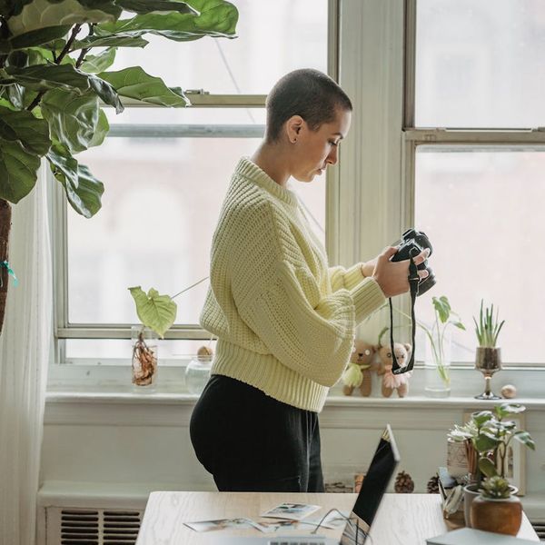 A minimalist workspace with a laptop, plant, and notebook, indicating a focus on digital wellness.